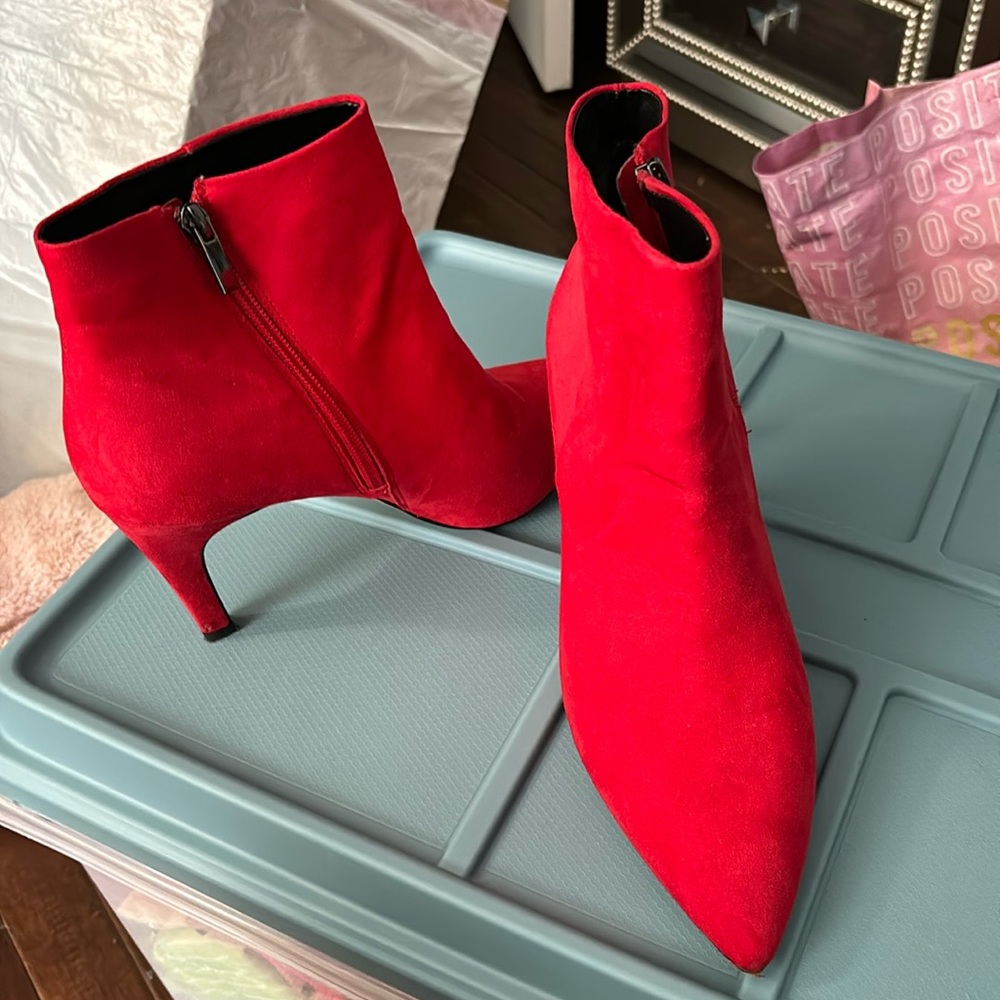 Red booty shoe with a heel wore them once in brand new condition